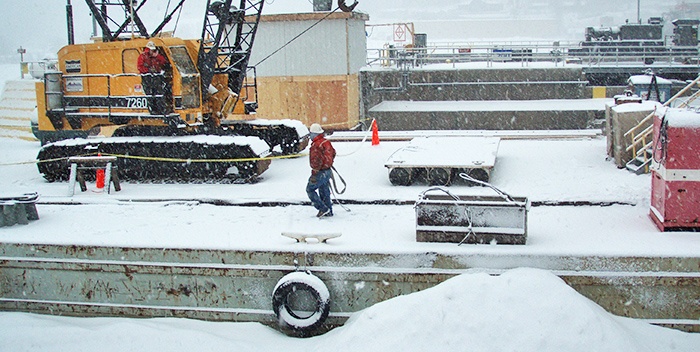 Cold weather construction, marine construction, barge snow, dam construction