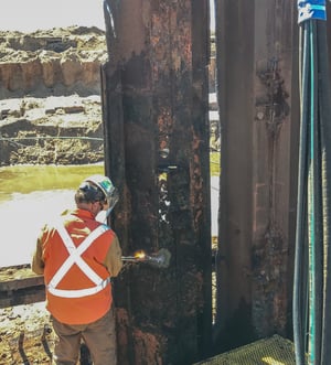 A Nelosca employee works on pitting - a byproduct of galvanic corrosion.