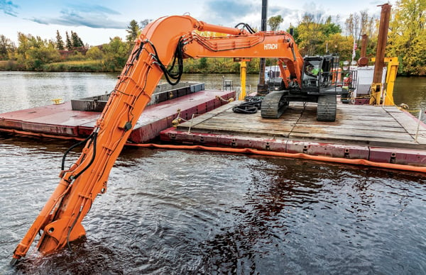 J.F. Nelosca excavator on water