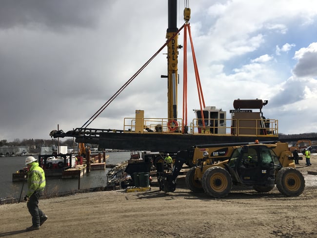 A Nelosca crew mobilizing dredge equipment